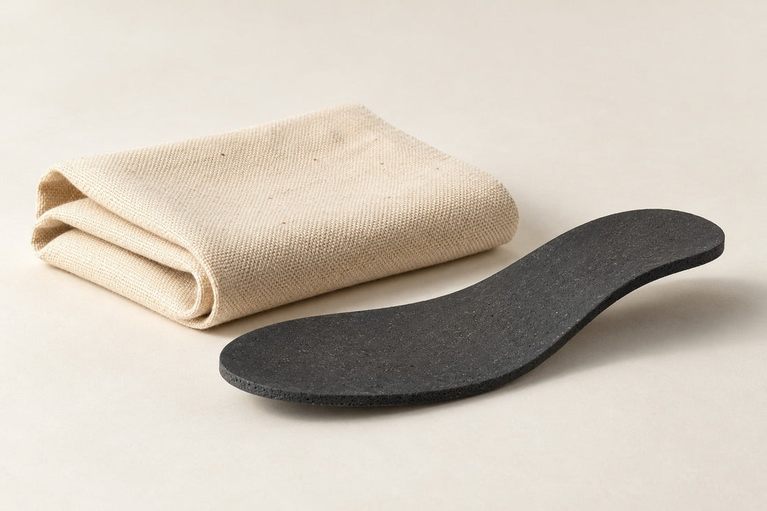Folded natural canvas beside a gently curved charcoal sole sample.